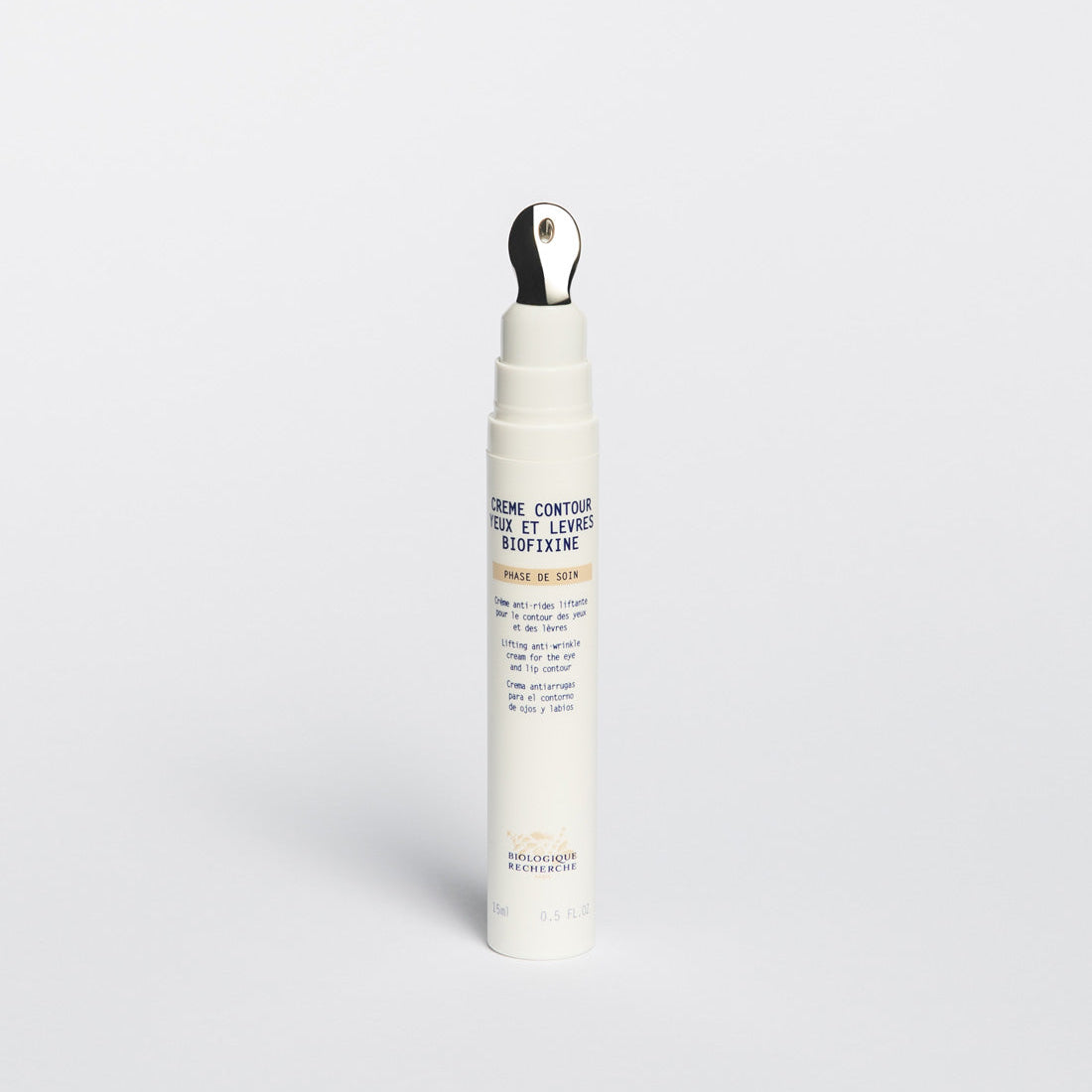 Small opened white jar 15ml labeled 'Crème Contour des Yeux Biofixine', anti-wrinkle eye cream on a white background, Biologique Recherche Amsterdam