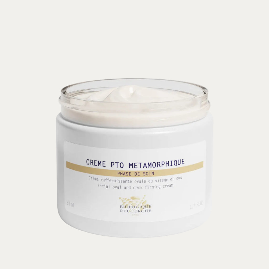 White opened cream jar labeled 'Crème Métamorphique', firming and lifting face cream on a white background, Biologique Recherche Amsterdam