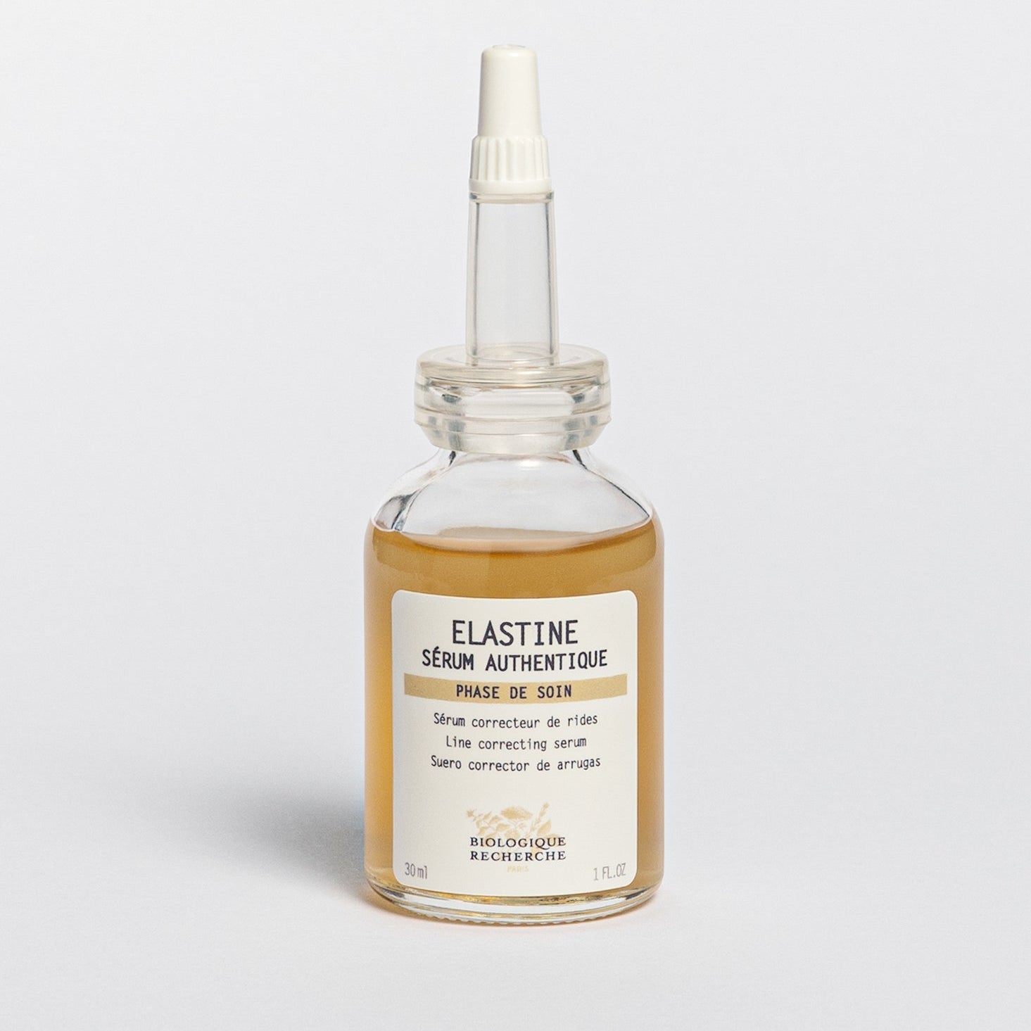 Glass serum bottle 30ml with pipette labeled 'Elastine Serum Authentique', Line correcting serum, on a white background, BR Amsterdam