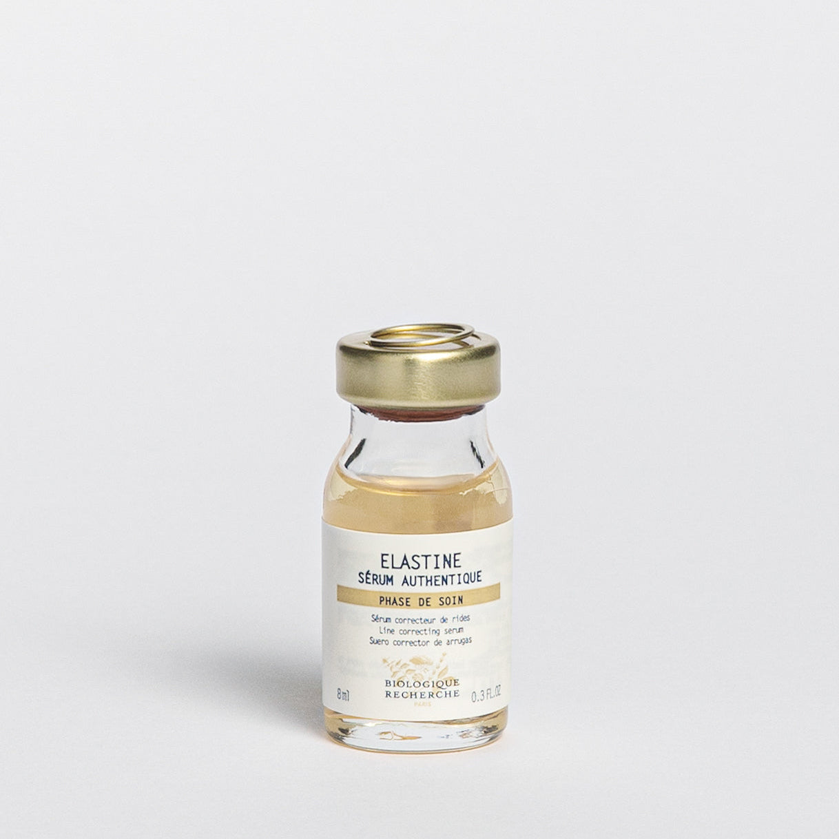 Glass serum bottle 8ml labeled 'Elastine Serum Authentique', Line correcting serum, on a white background, BR Amsterdam
