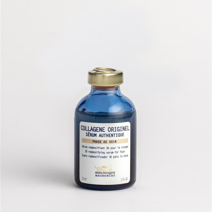 Bottle of 'Collagène Originel' serum with a gold cap on a light gray background 30ml