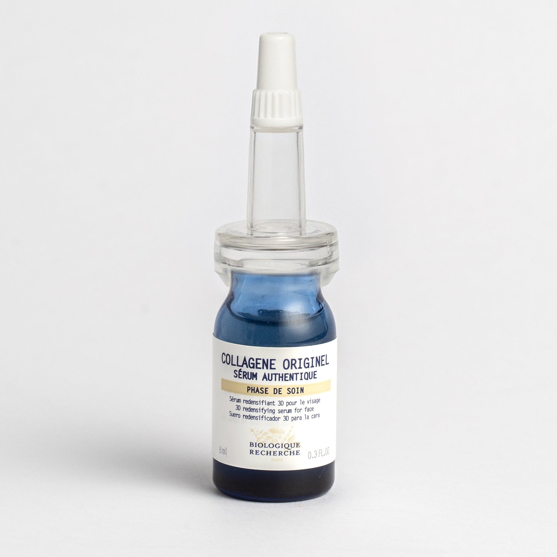 Bottle of 'Collagène Originel' serum with a pipette on a light gray background 30ml