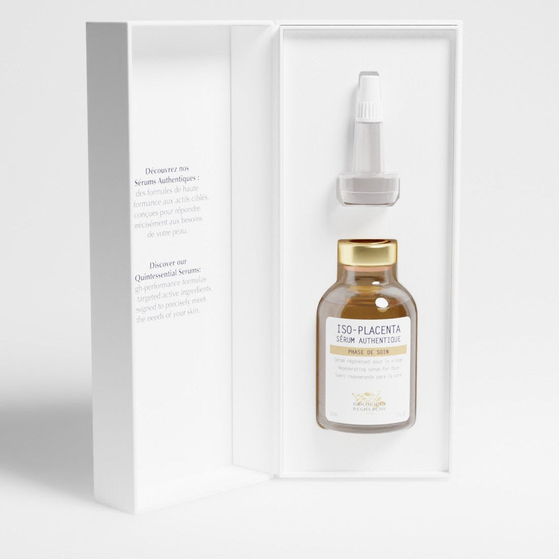 Glass serum bottle with gold cap and dropper 30ml labeled 'Iso-Placenta' in a white box, skin healing and regenerative serum on a white background, BR Amsterdam