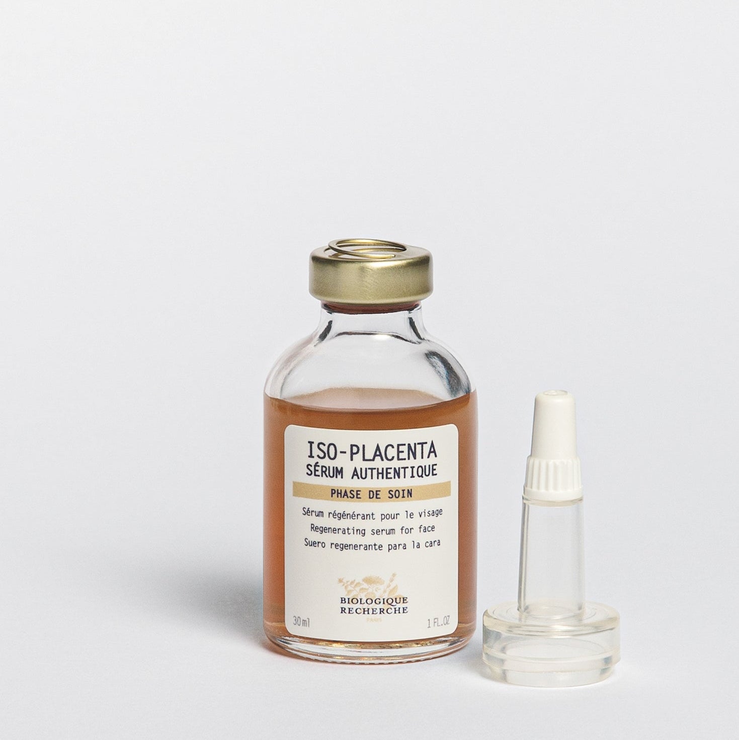 Glass serum closed bottle with dropper 30ml labeled 'Iso-Placenta', skin healing and regenerative serum on a white background, BR at Oasis Amsterdam