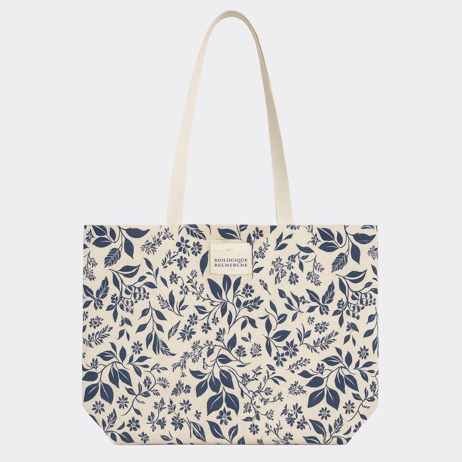 Tote bag with blue floral pattern on a white background