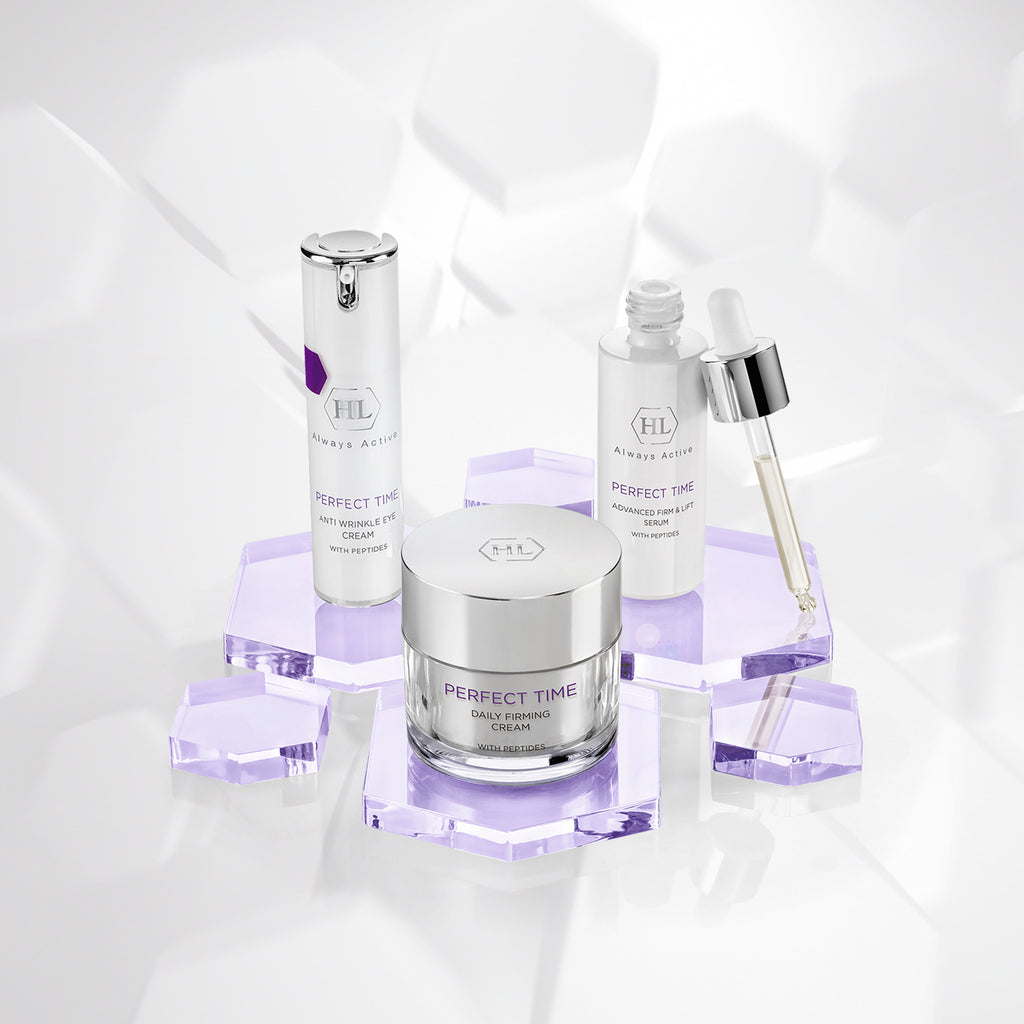 Skincare products including a jar, bottles, and dropper on a light gray background