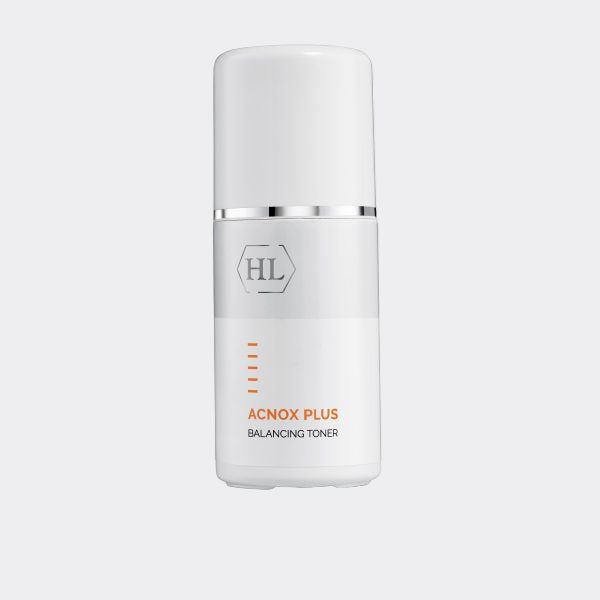 White skincare bottle labeled 'Acnox Plus Balancing Toner' on a white background
