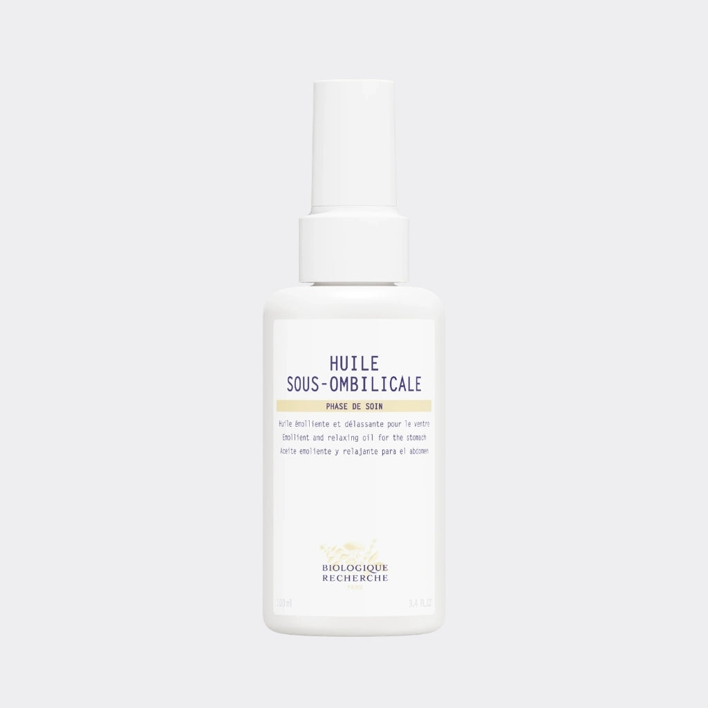White bottle of Huile Sous-Ombilicale on a white background Oasis Amsterdam