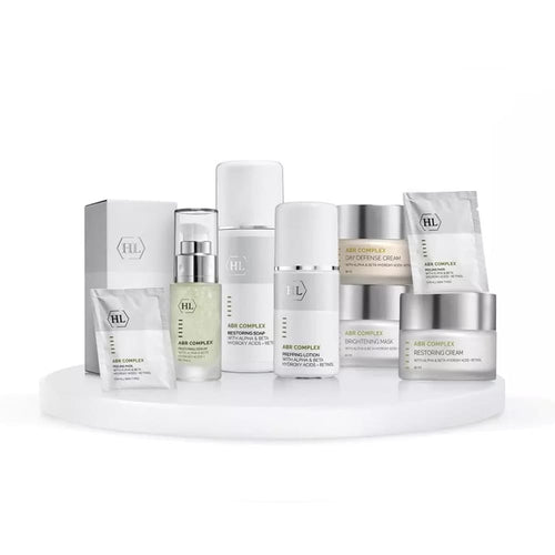 Skincare product set with various bottles and boxes on a white background