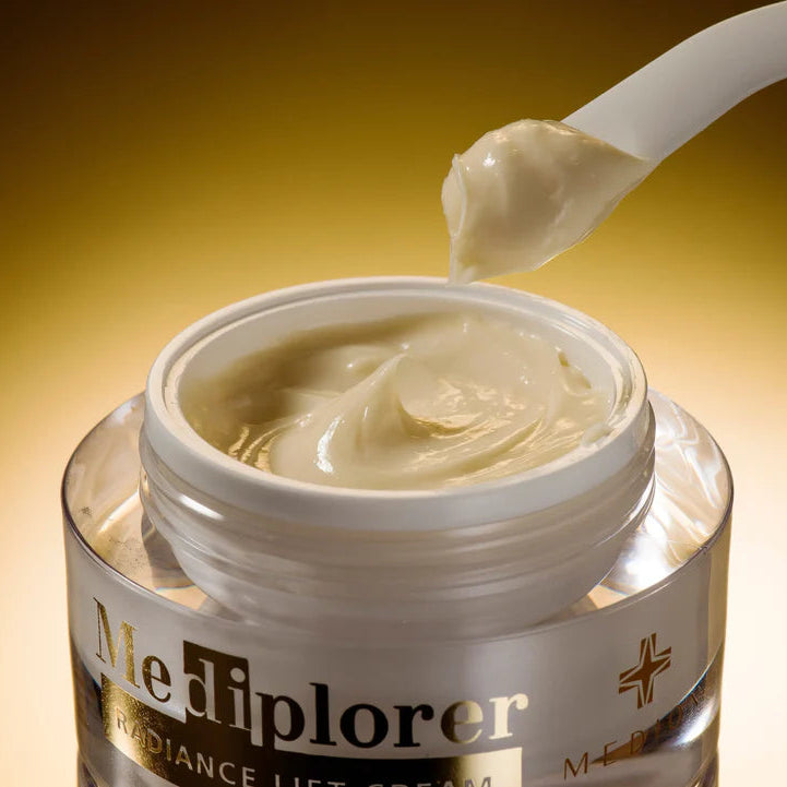 Jar of Mediplorer radiance lift cream with a spoonful, on a gold background